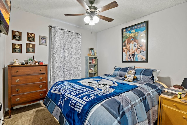 bedroom with carpet, ceiling fan, and a textured ceiling