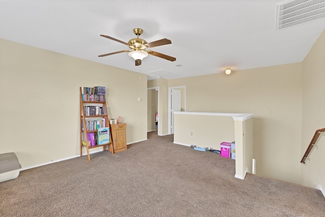 rec room with carpet flooring and ceiling fan