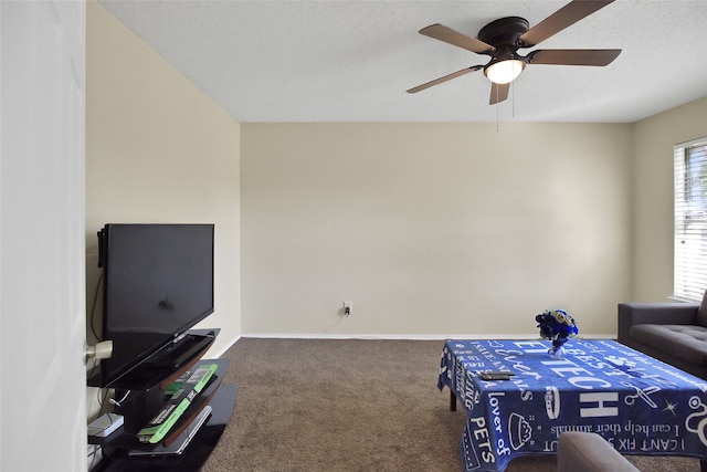 bedroom featuring ceiling fan, carpet flooring, and a textured ceiling