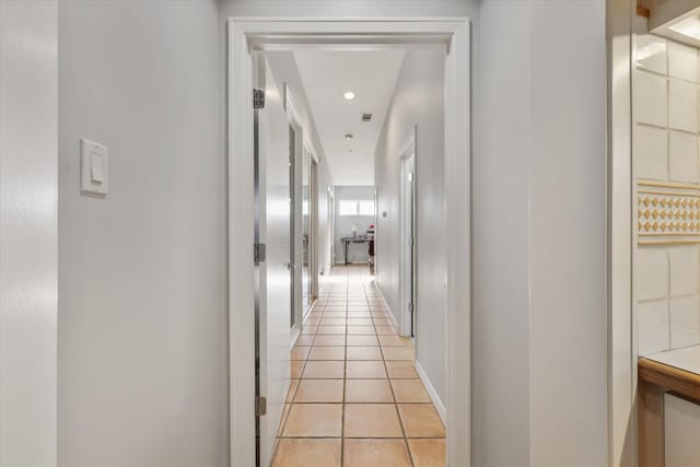 hallway with light tile patterned floors