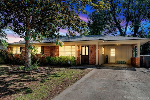 view of front of property with a carport