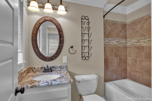 full bathroom with ornamental molding, vanity, tiled shower / bath, and toilet