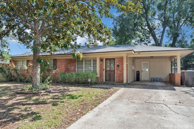 ranch-style home with a carport