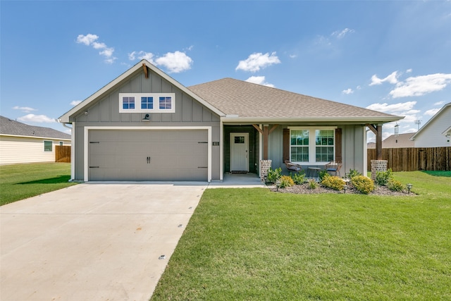 view of front of home with a garage and a front lawn