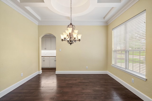 empty room with coffered ceiling, crown molding, dark wood-type flooring, and a wealth of natural light