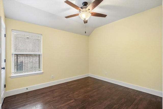 unfurnished room with vaulted ceiling, dark hardwood / wood-style floors, and ceiling fan