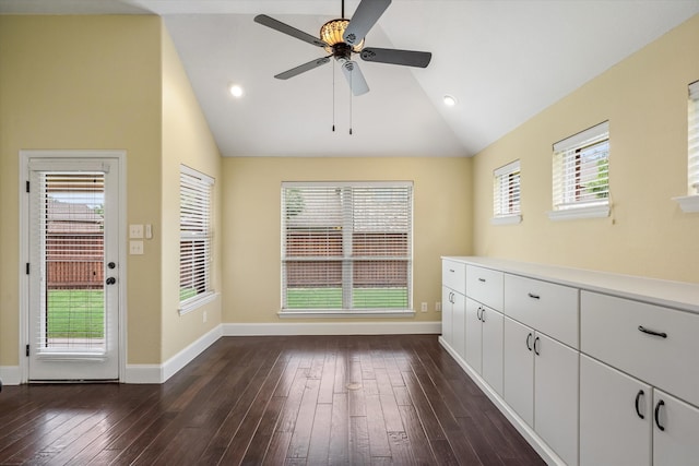 interior space featuring high vaulted ceiling, ceiling fan, and dark wood-type flooring