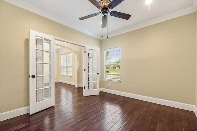 spare room with french doors, a wealth of natural light, dark wood-type flooring, and ceiling fan