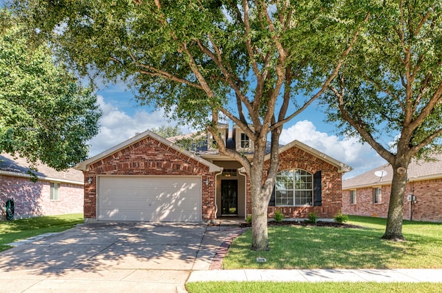 view of property with a garage and a front yard