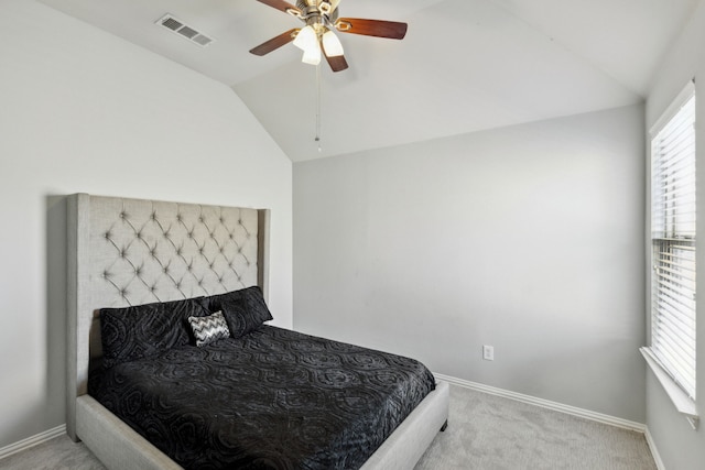 carpeted bedroom featuring vaulted ceiling and ceiling fan