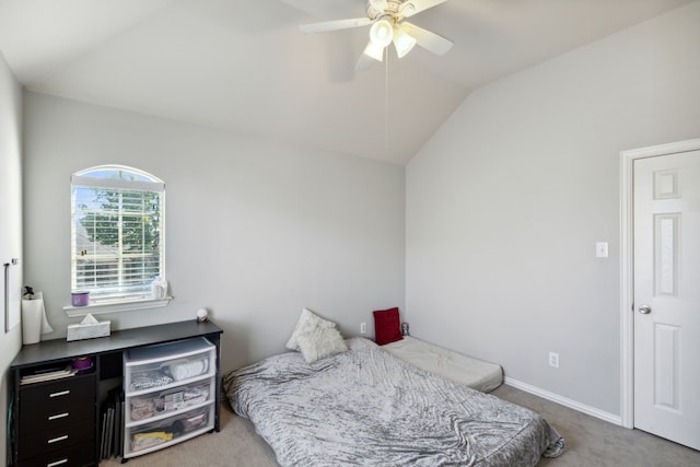 carpeted bedroom featuring vaulted ceiling and ceiling fan