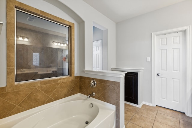 bathroom featuring independent shower and bath and tile patterned floors