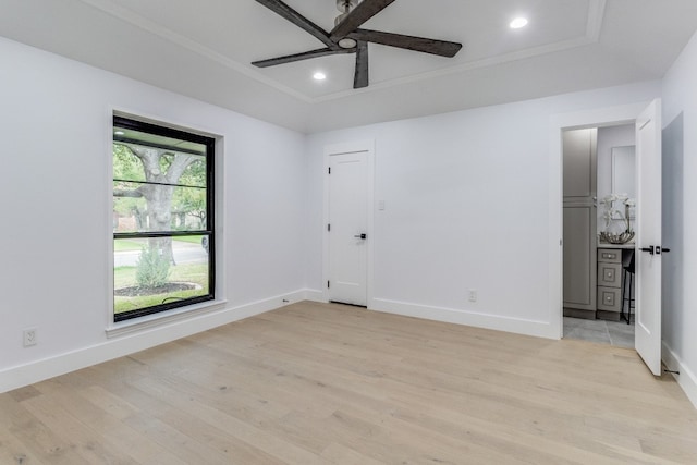 empty room featuring ornamental molding, ceiling fan, and light hardwood / wood-style flooring