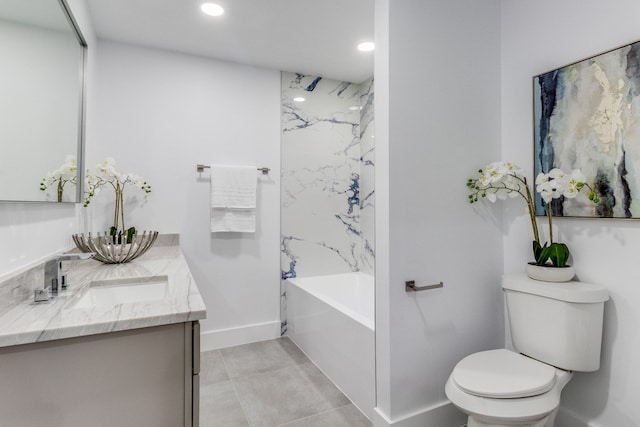 bathroom with vanity, tile patterned flooring, and toilet