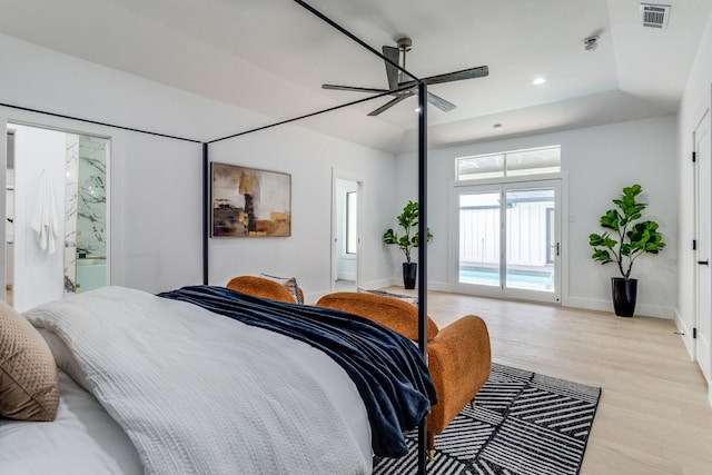 bedroom featuring lofted ceiling, ceiling fan, connected bathroom, light hardwood / wood-style floors, and access to exterior