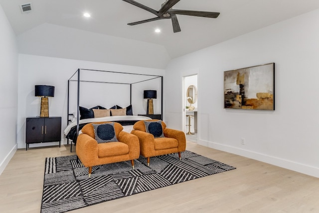 bedroom with ceiling fan, vaulted ceiling, and light hardwood / wood-style floors