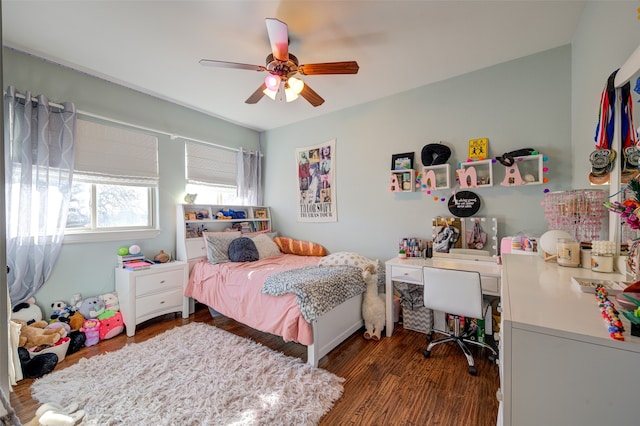 bedroom with ceiling fan and dark wood-type flooring