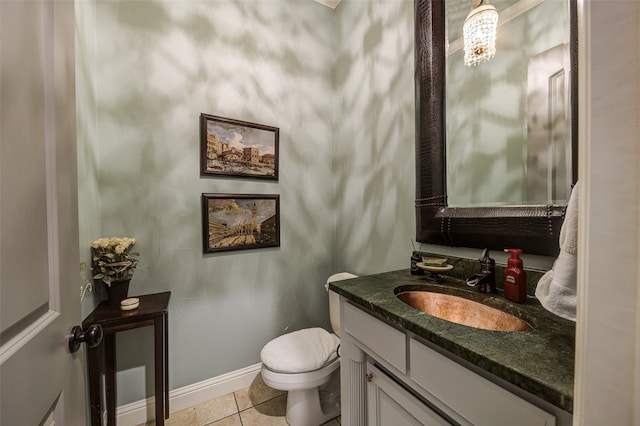 bathroom with tile patterned floors, vanity, and toilet