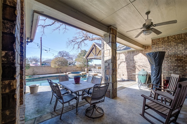 view of patio with ceiling fan and a fenced in pool