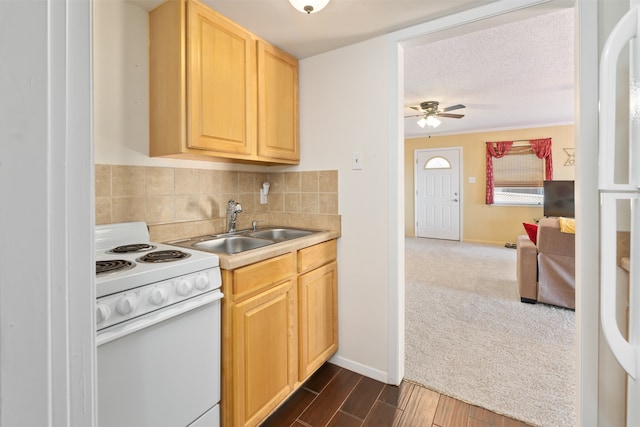 kitchen with dark wood-type flooring, white electric range oven, light brown cabinets, ceiling fan, and sink