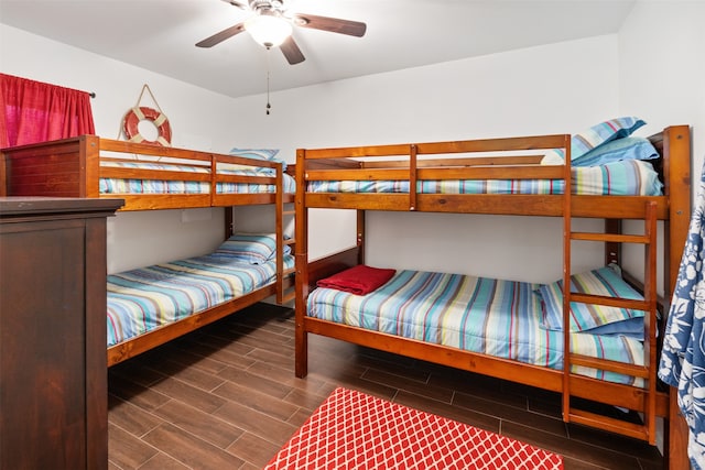 bedroom with ceiling fan and hardwood / wood-style floors