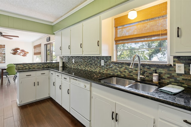 kitchen featuring white cabinetry, ceiling fan, white dishwasher, and a wealth of natural light