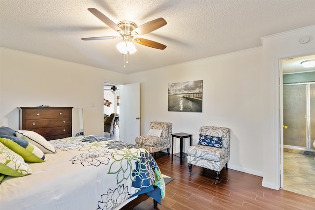 bedroom featuring a textured ceiling, dark hardwood / wood-style flooring, and ceiling fan