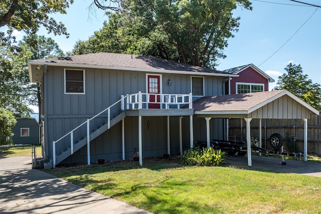 107 Briarwood Dr, Mabank, TX 75156 - view of front facade with fence, stairs, a front lawn, board and batten siding, and roof with shingles