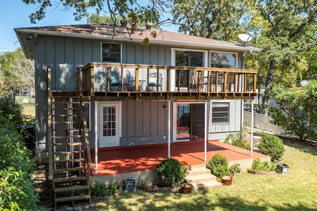 107 Briarwood Dr, Mabank, TX 75156 - rear view of property featuring board and batten siding, a yard, and a patio area