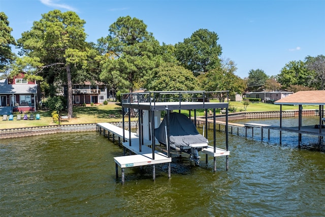 view of dock featuring a yard and a water view