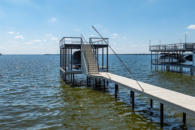 dock area with a water view