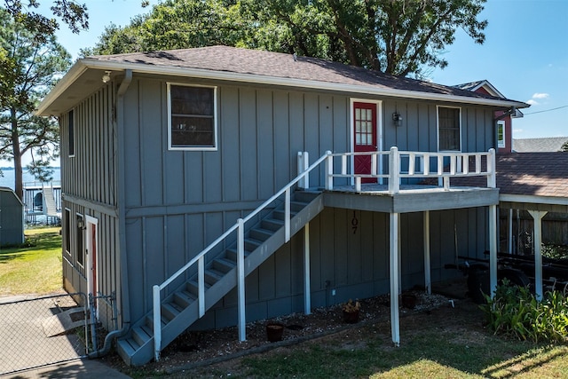 107 Briarwood Dr, Mabank, TX 75156 - view of front of house featuring board and batten siding, stairway, and roof with shingles