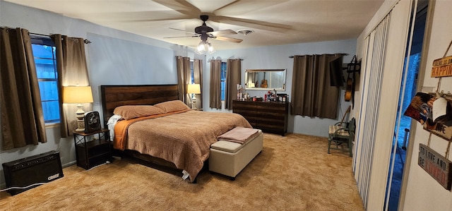 bedroom featuring ceiling fan and light colored carpet