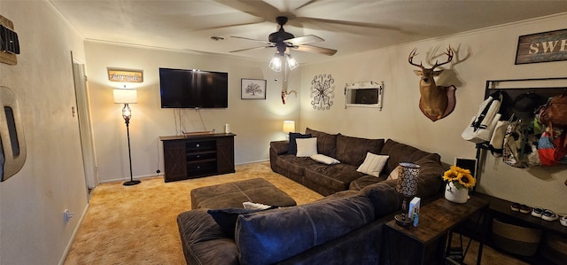 carpeted living room featuring ceiling fan and crown molding