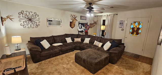 carpeted living room with ceiling fan and ornamental molding