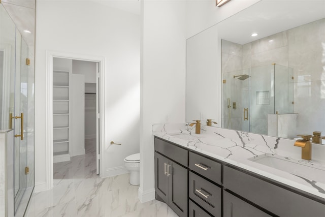 bathroom featuring walk in shower, vanity, and toilet