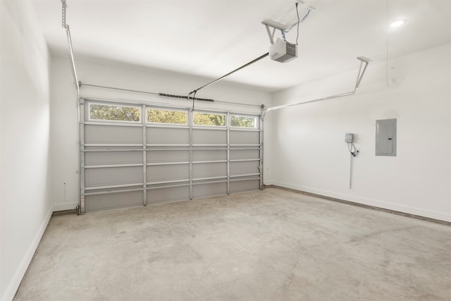 garage with electric panel and a garage door opener