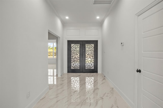 entryway featuring ornamental molding