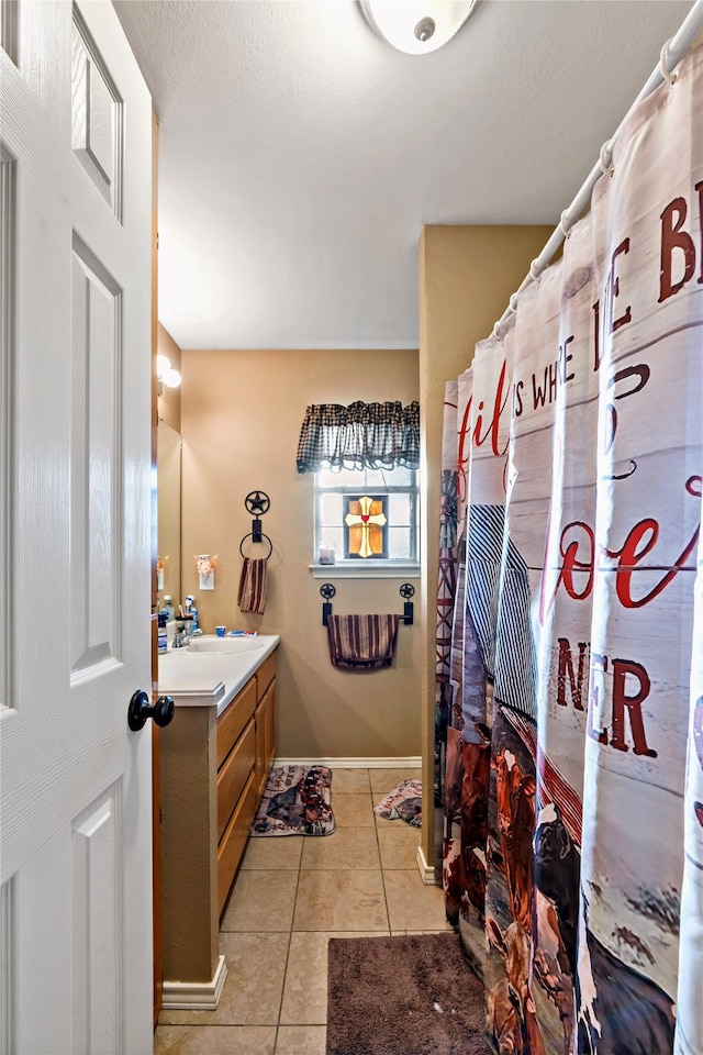 bathroom with vanity and tile patterned floors