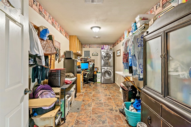 interior space featuring stacked washer / drying machine