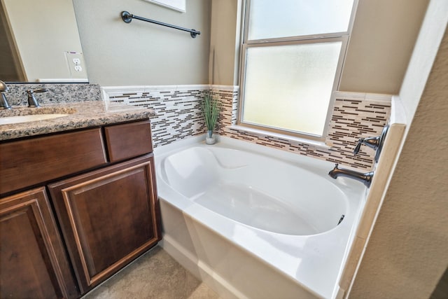 bathroom featuring vanity and a bathing tub