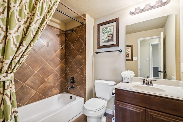 full bathroom featuring vanity, toilet, shower / bath combo with shower curtain, and a textured ceiling