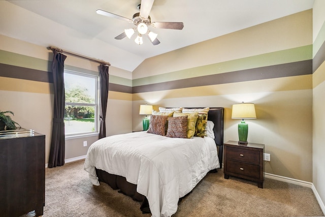 bedroom with light colored carpet, vaulted ceiling, and ceiling fan