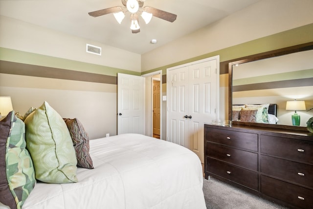 bedroom with ceiling fan and light carpet