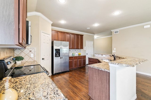 kitchen with sink, ornamental molding, appliances with stainless steel finishes, tasteful backsplash, and light stone counters