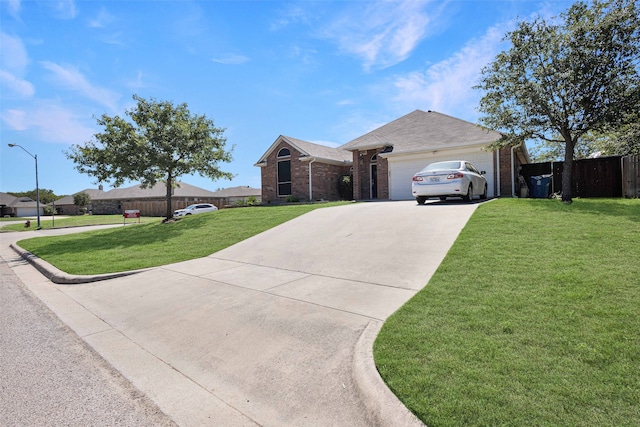 ranch-style home featuring a garage and a front lawn