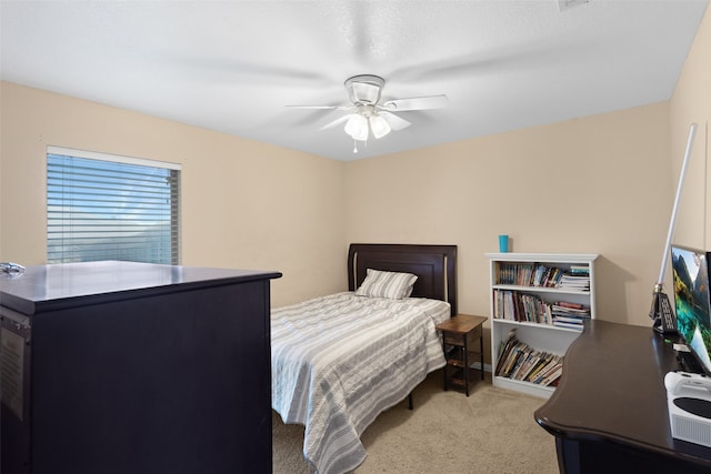 carpeted bedroom with ceiling fan