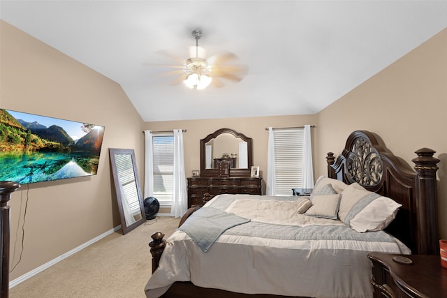 bedroom featuring vaulted ceiling, ceiling fan, and light colored carpet