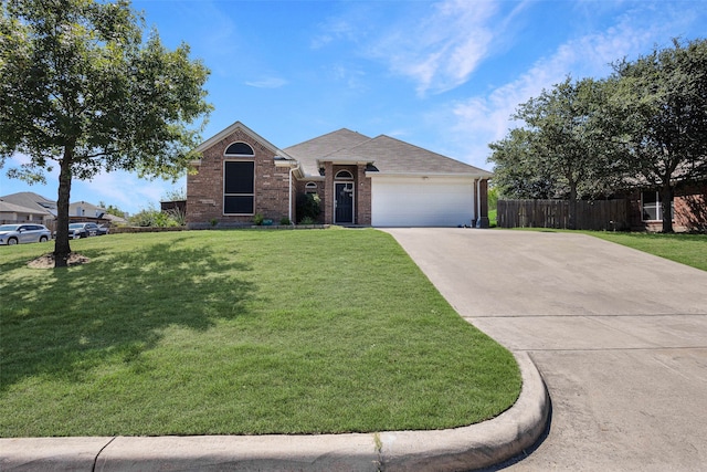 ranch-style home featuring a front yard and a garage