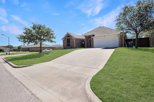 ranch-style house featuring a garage and a front lawn